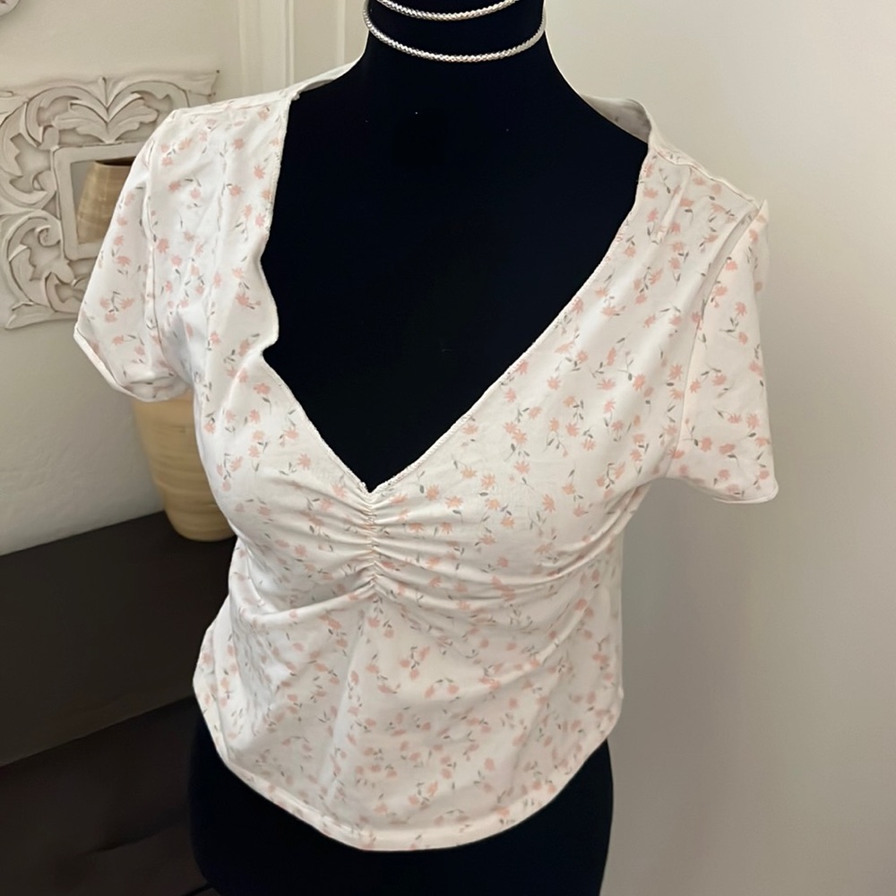 floral delicate top with rouched front.